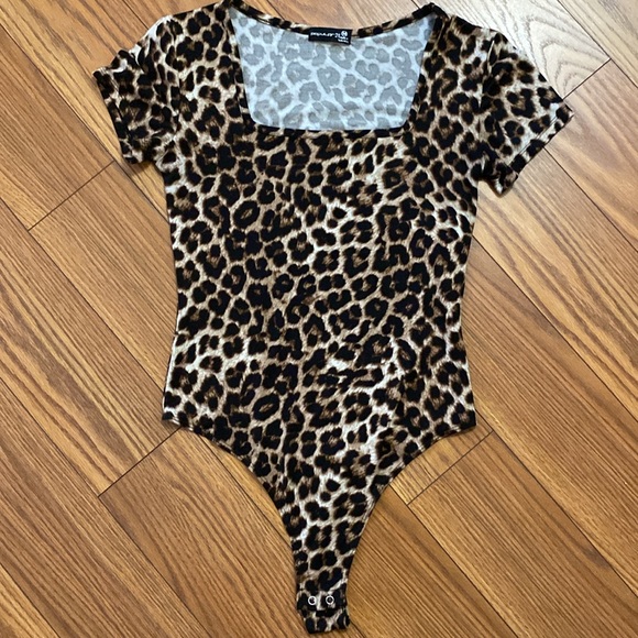 polular 21 Tops - Popular 21 women’s animal print square neckline bodysuit thong snap closure M